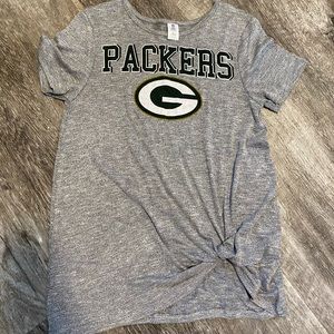Green Bay packers shirt.